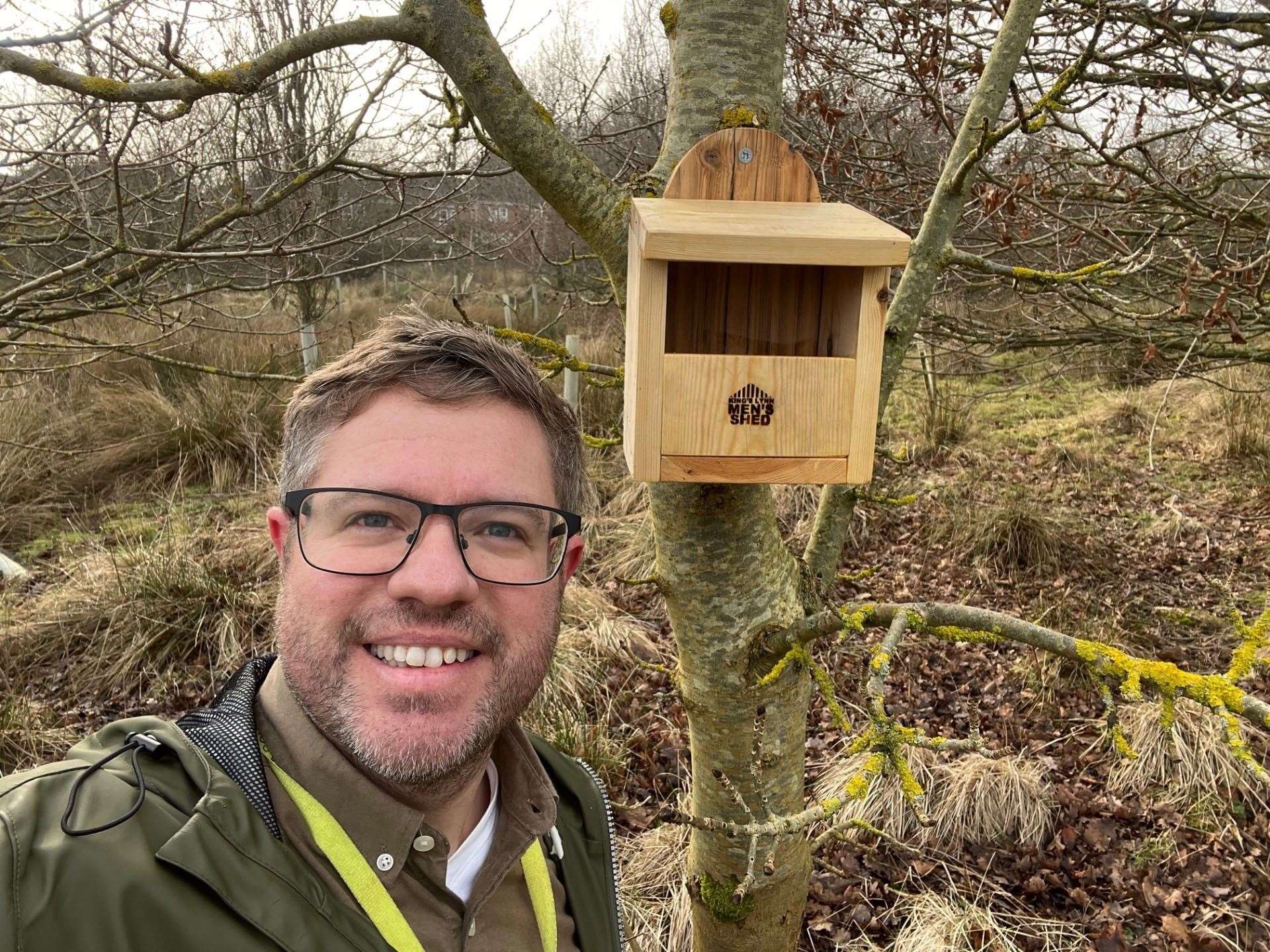 Cllr Rob Colwell with one of the 20 nest boxes made byLynn Men’s Shed that went up on the site as part of nest box week in February